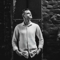 Schwarzweißfoto des Mitarbeiters Mihail Trahtenberg.